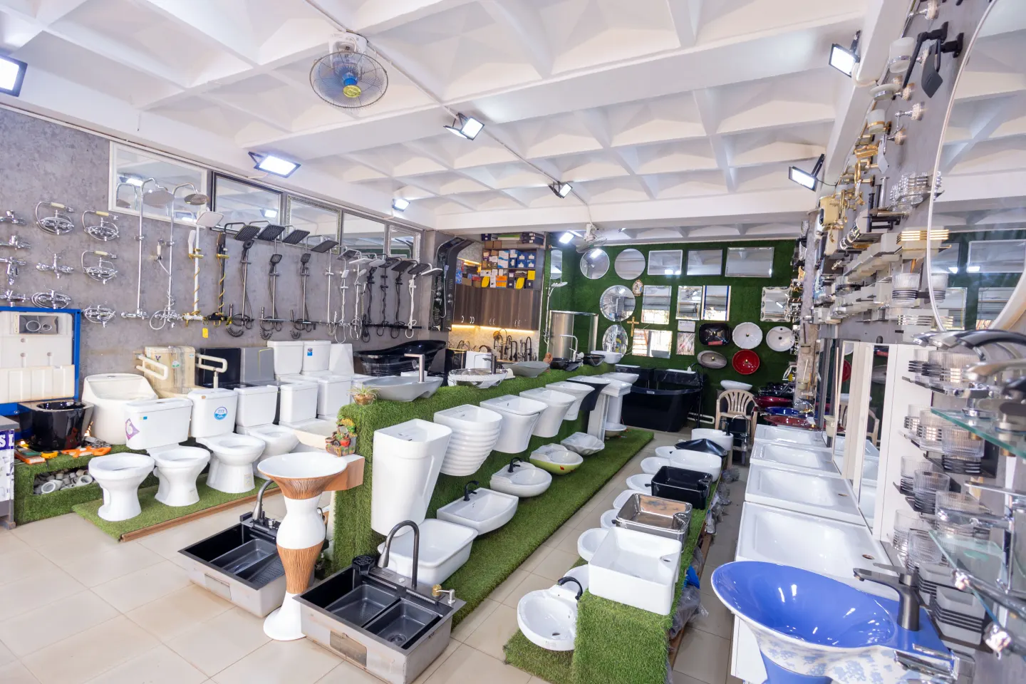 Showers, toilets and wash basins displayed across the showroom